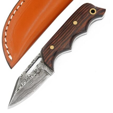 Close-up of Damascus Skinner Knife showing silver-grey wave patterns, pointed blade and elongated upper blade opening