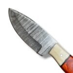 Reddish brown handle Damascus hunting knife featuring a silver-gray patterned fixed blade, cream front handle accent and brown stitched sheath