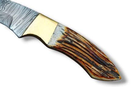 Damascus Gut Hook Hunting Knife with Patterned Steel Blade, Gut Hook Notch, Brass-Tone Bolster and Brown Antler-Style Handle
