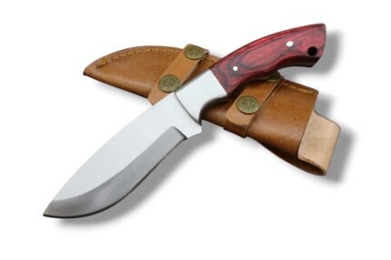 Red Wood Handle Hunting Knife with broad curved silver blade, metal bolster, red and black wood-grain-style handle, and tan-brown stitched sheath