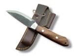 Rustic fixed blade knife with a dark textured blade, brown grain-pattern handle, two silver-tone pins, and bright bolster over a brown stitched sheath.