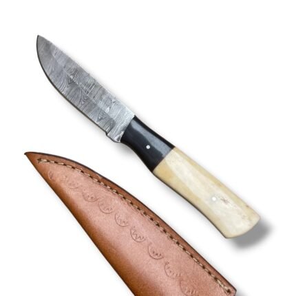 Damascus Pattern Hunting Knife with silver-grey patterned blade, black and cream two-tone handle, and brown stitched sheath