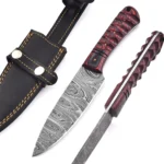 Red black Damascus hunting knife with a pointed silver-gray patterned blade, red-and-black carved-look handle and black stitched sheath with two silver fasteners.